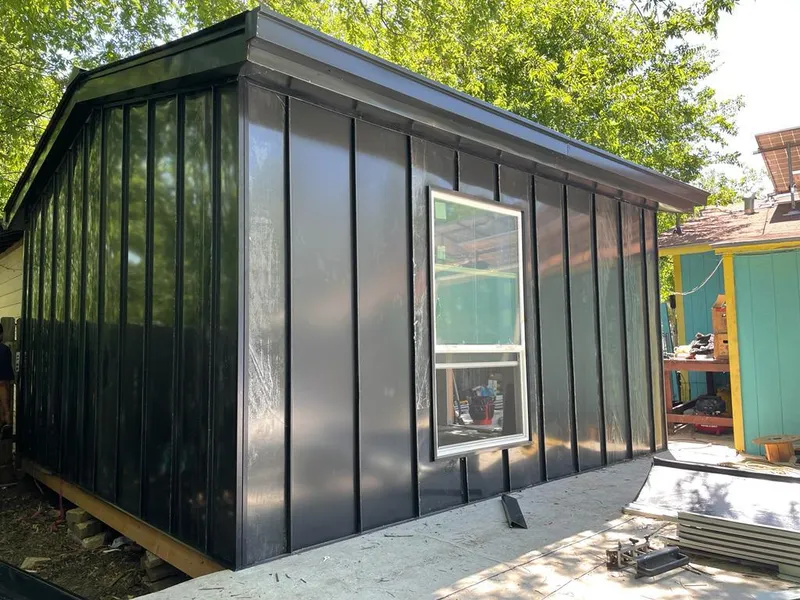 Black standing seam metal wall panels for Roof Inspection in Newton